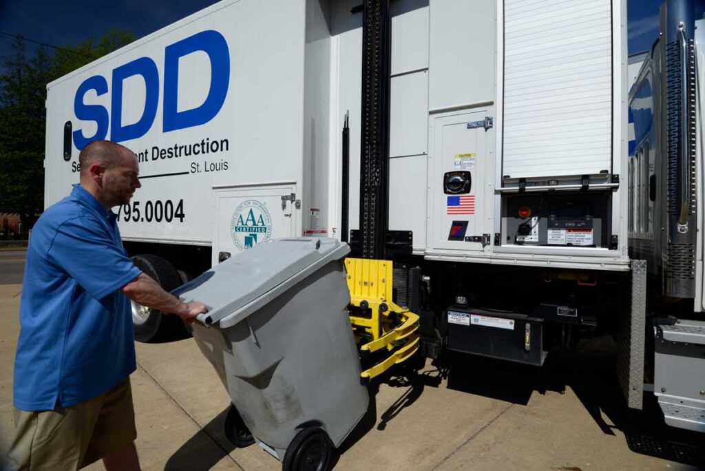 Onsite shredding ensures the important documents in your locked bin go straight to the SDD truck in this this photo to be shredded on site.